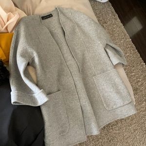 Like new coat sits at thigh high